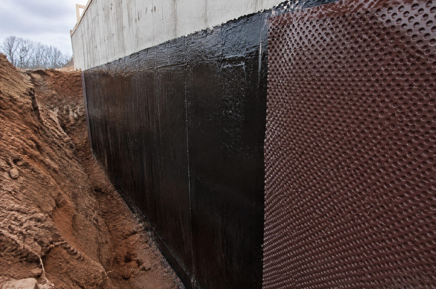 Exterior foundation waterproofing membrane on a Charlotte, NC home